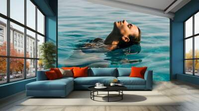 Young woman swim in the swimming pool Wall mural